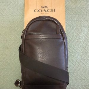 Leather Coach CrossOver w/Outside storage pockets.